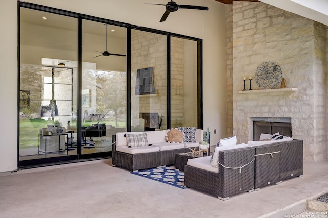 interior space with ceiling fan, a fireplace, concrete floors, and high vaulted ceiling