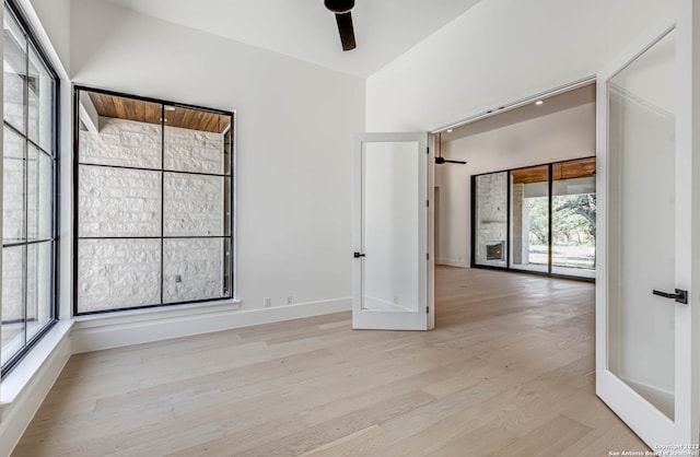 empty room featuring ceiling fan and light wood-type flooring