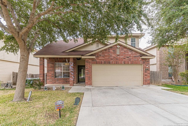 view of front of home with a front yard and a garage