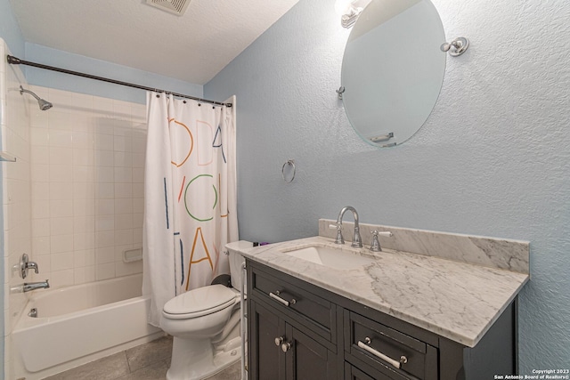 full bathroom featuring shower / bath combo, toilet, tile floors, a textured ceiling, and large vanity