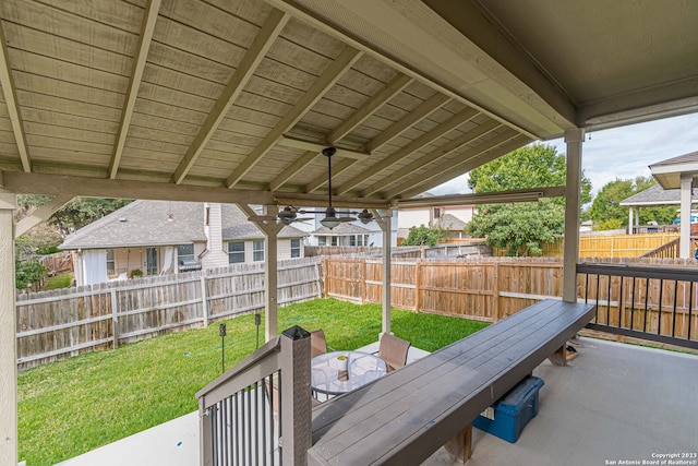 wooden terrace featuring a gazebo, a lawn, ceiling fan, and a patio