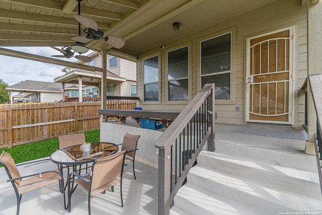 exterior space with ceiling fan