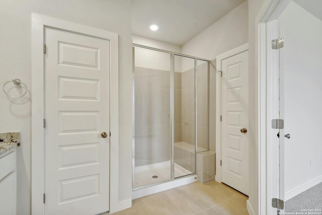 bathroom with vanity and an enclosed shower