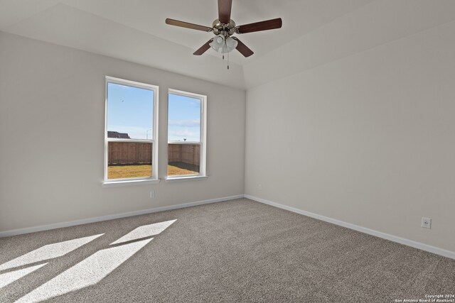 carpeted empty room featuring ceiling fan