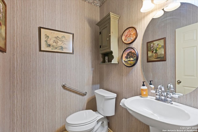 bathroom featuring sink and toilet