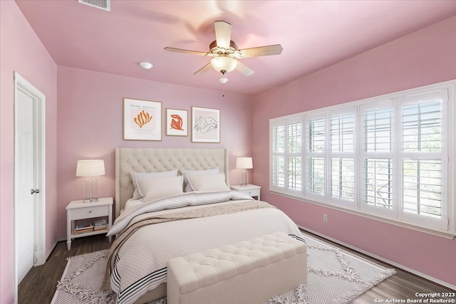 bedroom with dark wood-type flooring and ceiling fan