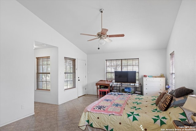 bedroom with lofted ceiling, ceiling fan, and light tile floors