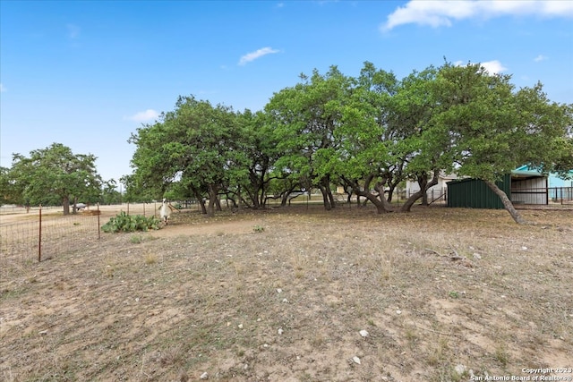 view of yard with a rural view