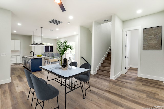 dining room featuring dark hardwood / wood-style floors and sink