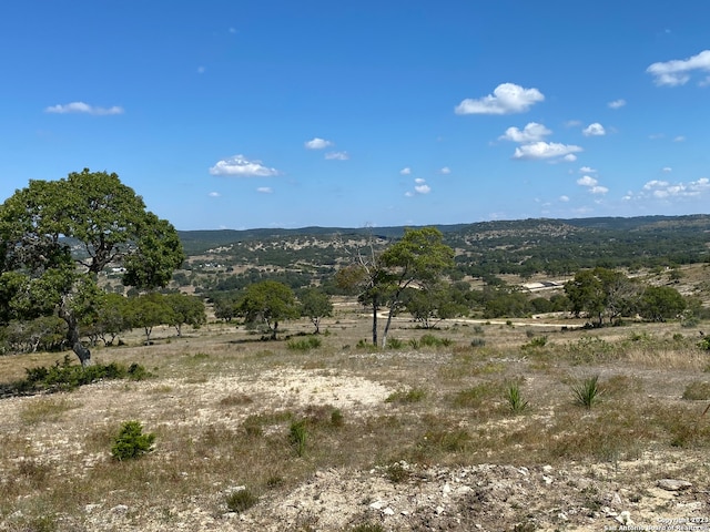 property view of mountains featuring a rural view