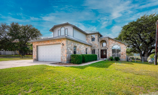 view of front of house featuring a garage and a front lawn