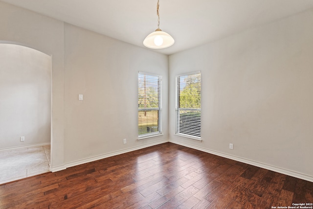 spare room featuring hardwood / wood-style floors