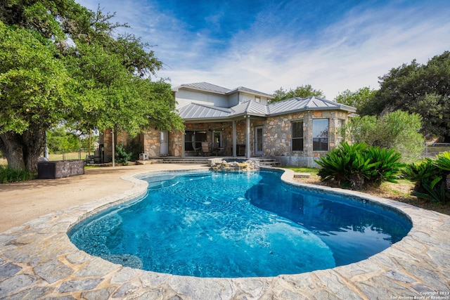 view of swimming pool featuring a patio