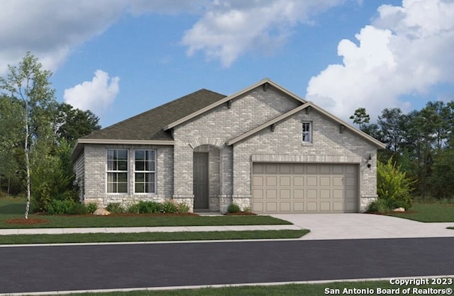 french country style house with driveway, a garage, and brick siding