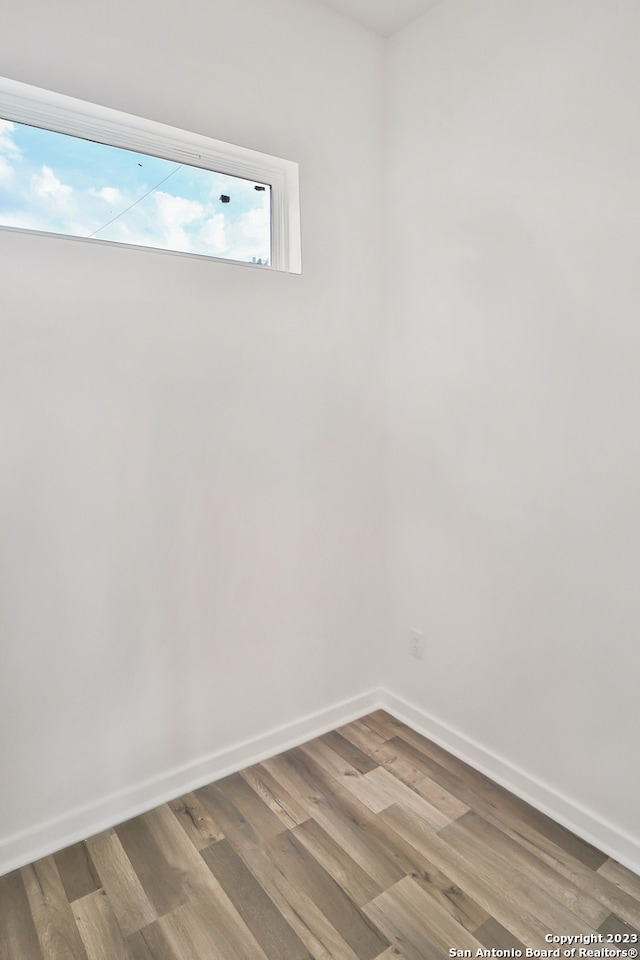 spare room featuring hardwood / wood-style flooring