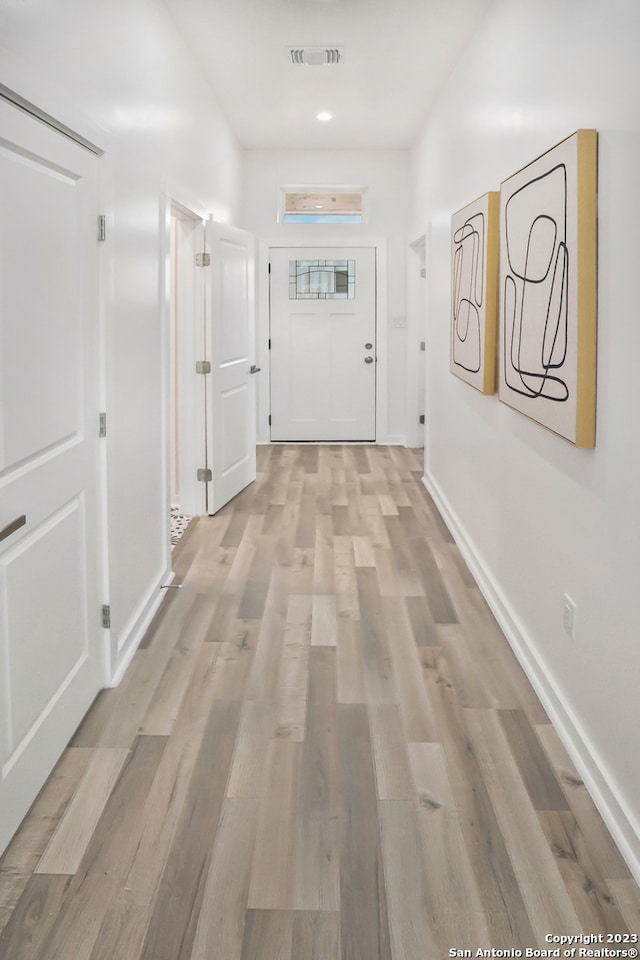 hallway featuring light hardwood / wood-style flooring