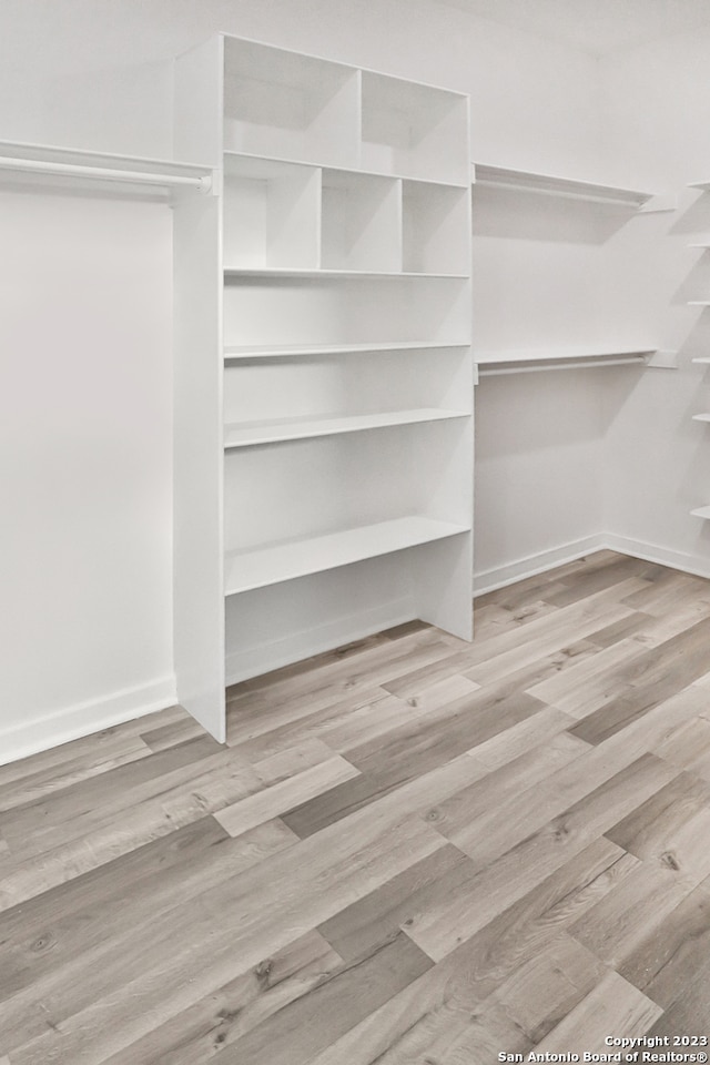 walk in closet featuring light wood-type flooring