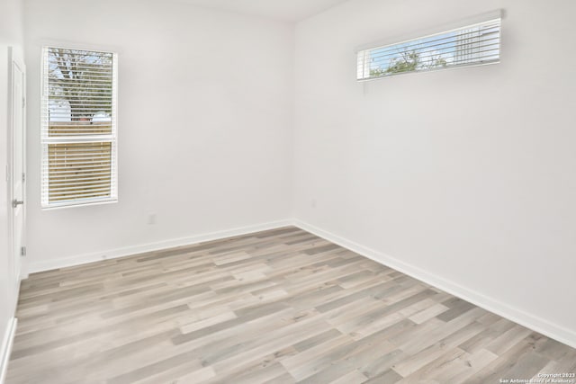 spare room with light wood-type flooring