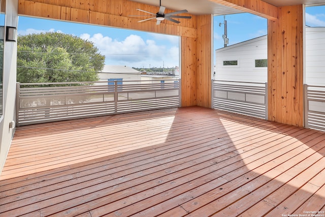 wooden deck featuring ceiling fan