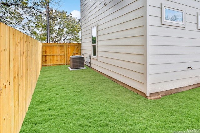 view of yard with central AC unit