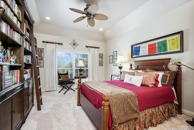 carpeted bedroom featuring lofted ceiling and ceiling fan