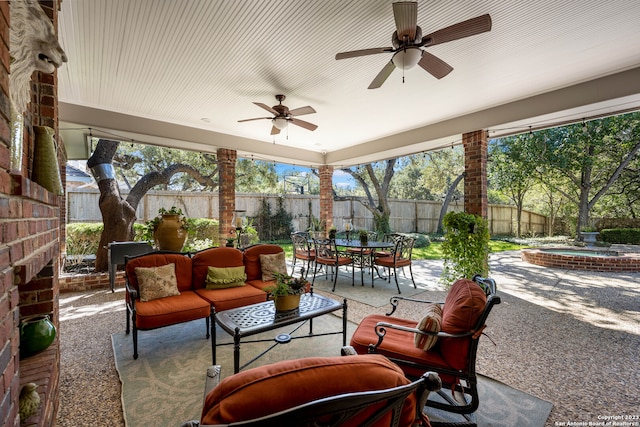 view of terrace featuring an outdoor living space and ceiling fan