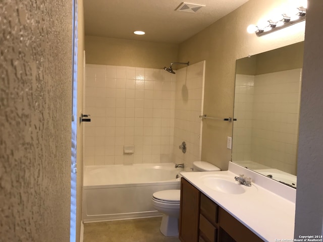 full bathroom featuring tile flooring, large vanity, toilet, and tiled shower / bath combo