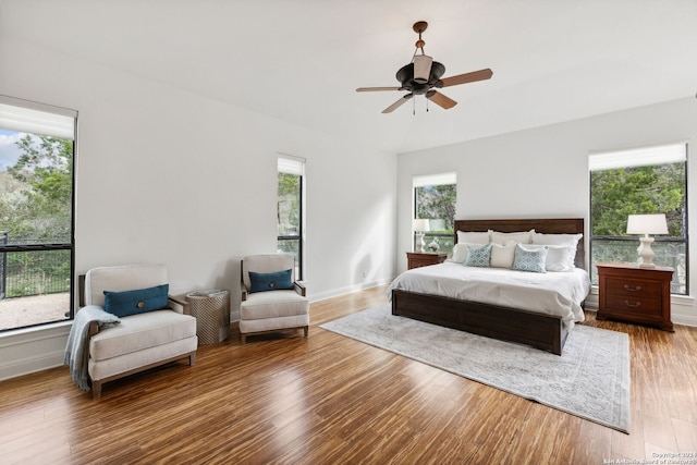 bedroom with hardwood / wood-style floors and ceiling fan