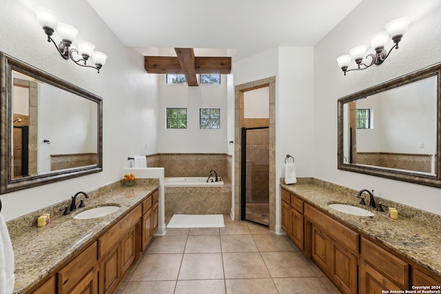 bathroom featuring vanity, tile patterned flooring, and plus walk in shower