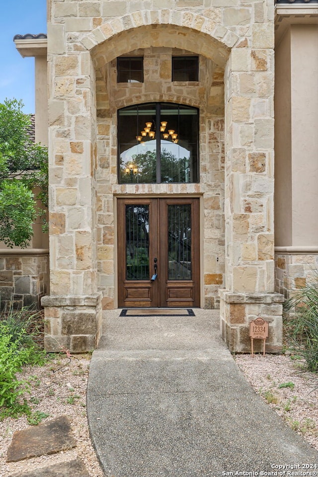 entrance to property featuring french doors