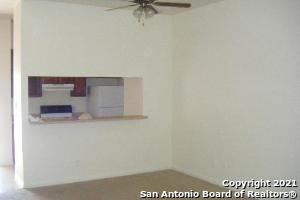 interior space featuring ceiling fan