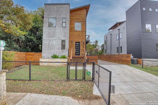 contemporary home with a front lawn