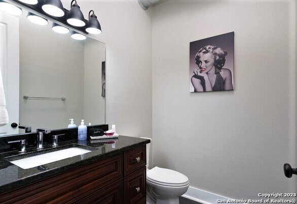 bathroom featuring vanity and toilet