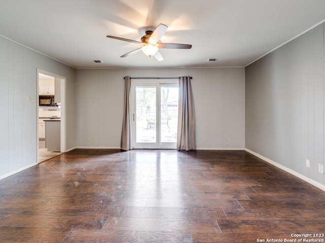 spare room with wood-type flooring and ceiling fan