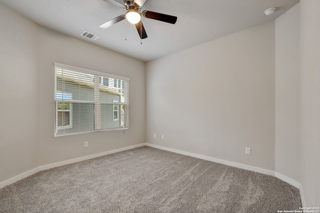 spare room with carpet floors and ceiling fan