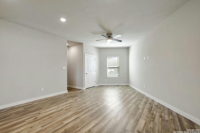 unfurnished room featuring ceiling fan and light hardwood / wood-style flooring