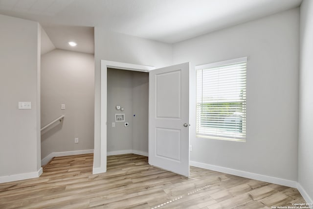 unfurnished bedroom with light wood-type flooring