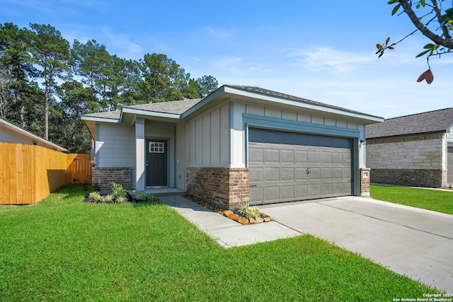 ranch-style house with a garage and a front lawn