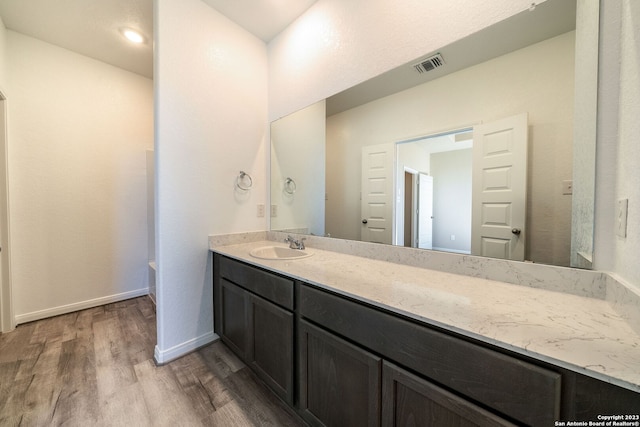 bathroom featuring vanity and hardwood / wood-style flooring