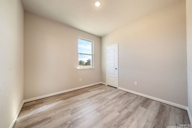 unfurnished room with light hardwood / wood-style flooring