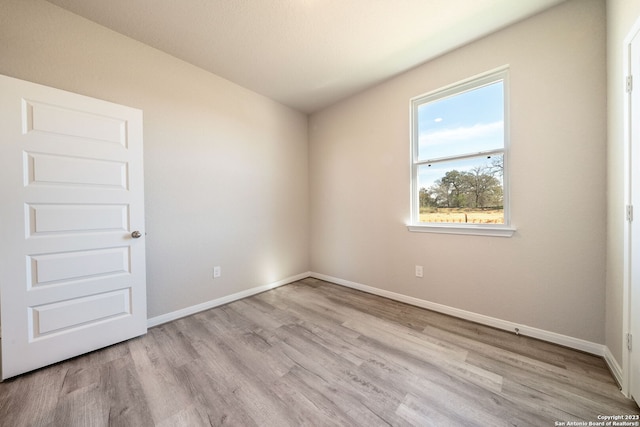 unfurnished room featuring light wood-type flooring