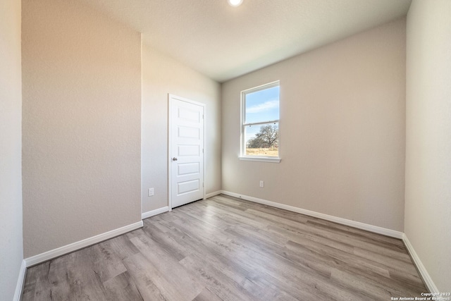 unfurnished room with light hardwood / wood-style flooring