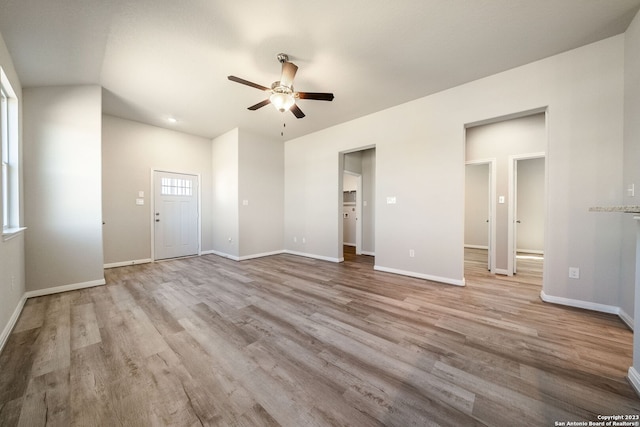 interior space with ceiling fan and light hardwood / wood-style floors