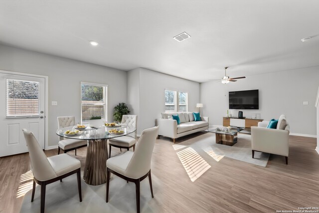 dining room featuring ceiling fan and light wood-type flooring