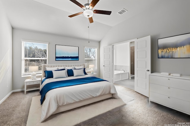 bedroom with ceiling fan, ensuite bathroom, and vaulted ceiling