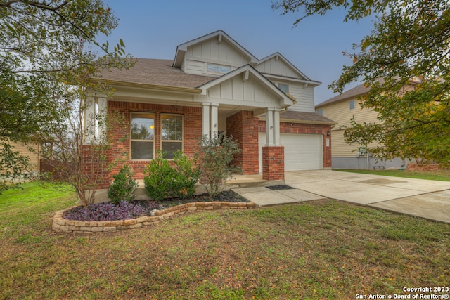 craftsman-style house with a front yard and a garage