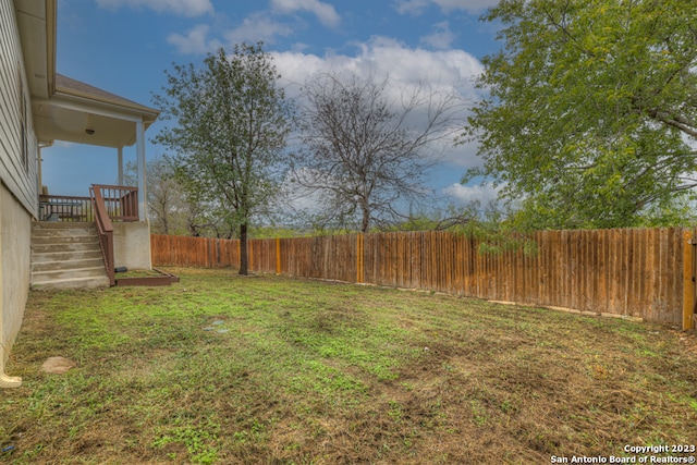 view of yard featuring a wooden deck