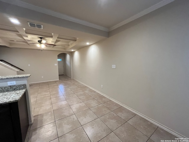 interior space featuring coffered ceiling, light stone countertops, ceiling fan, light tile flooring, and crown molding