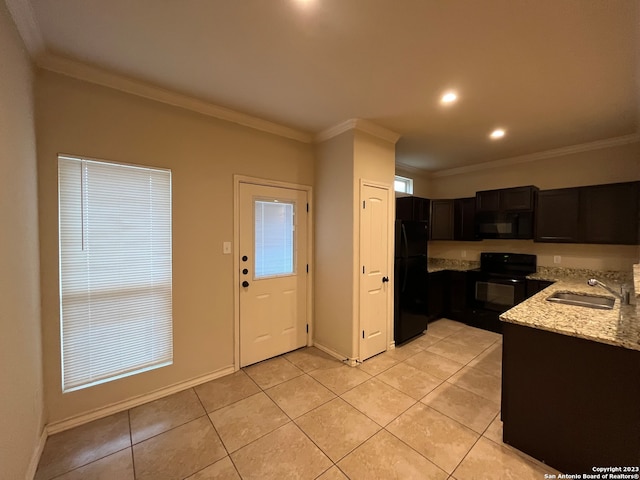 kitchen featuring ornamental molding, sink, and black appliances