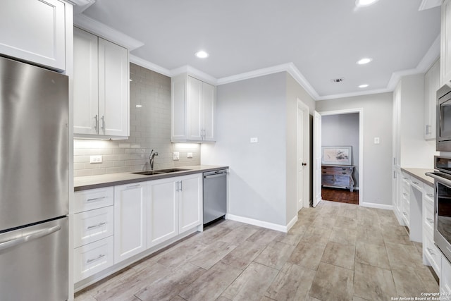 kitchen featuring white cabinets, light hardwood / wood-style floors, stainless steel appliances, and sink